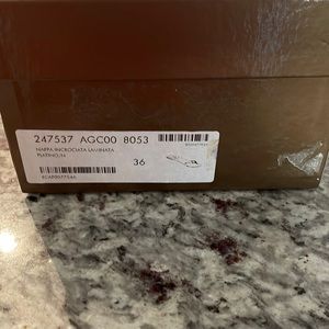 Gold Gucci Flip Flops